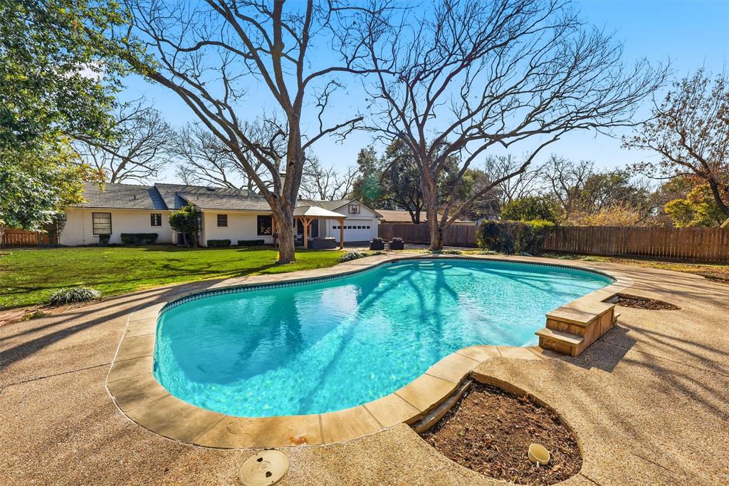 6724 Kirkwood Road Fort Worth, TX 76116 - Photo 36 of 40 a view of a house with swimming pool and sitting area