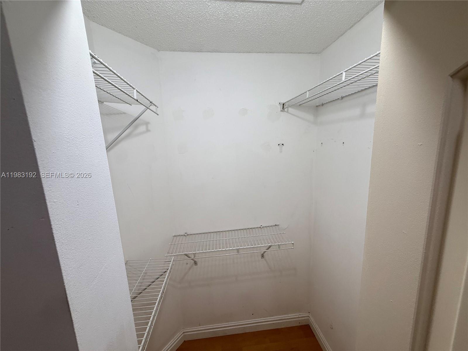 18260 Southwest 142nd Place Miami, FL 33177 - Photo 11 of 30 a view of walk in closet