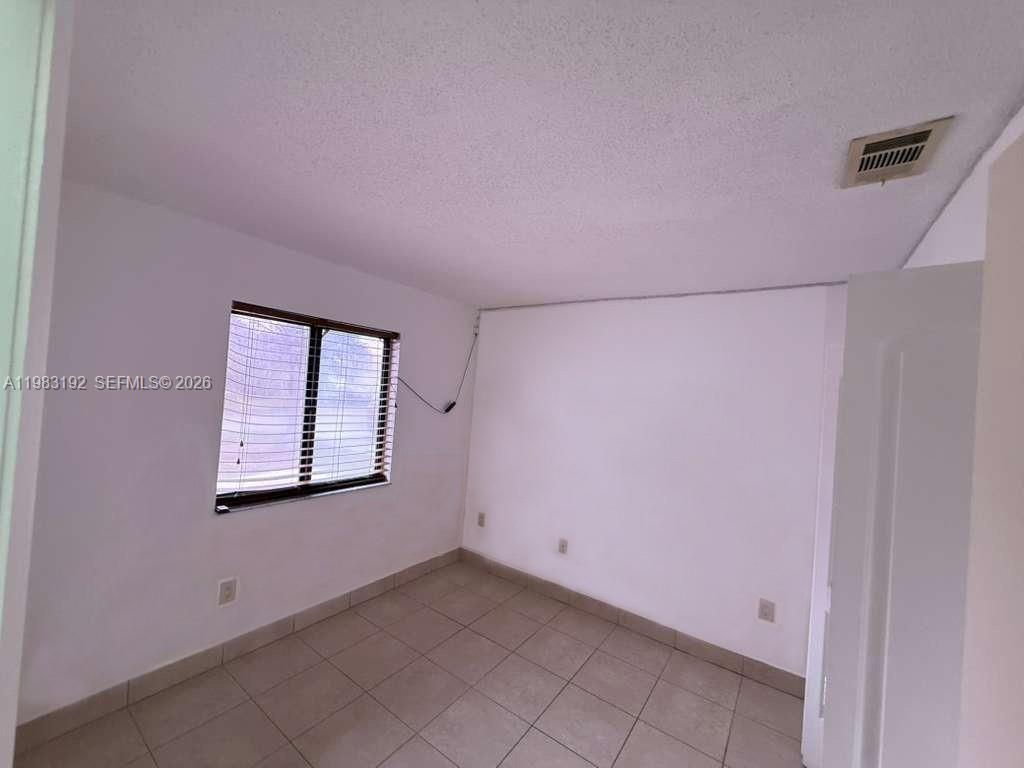 18260 Southwest 142nd Place Miami, FL 33177 - Photo 12 of 30 a view of an empty room with a window