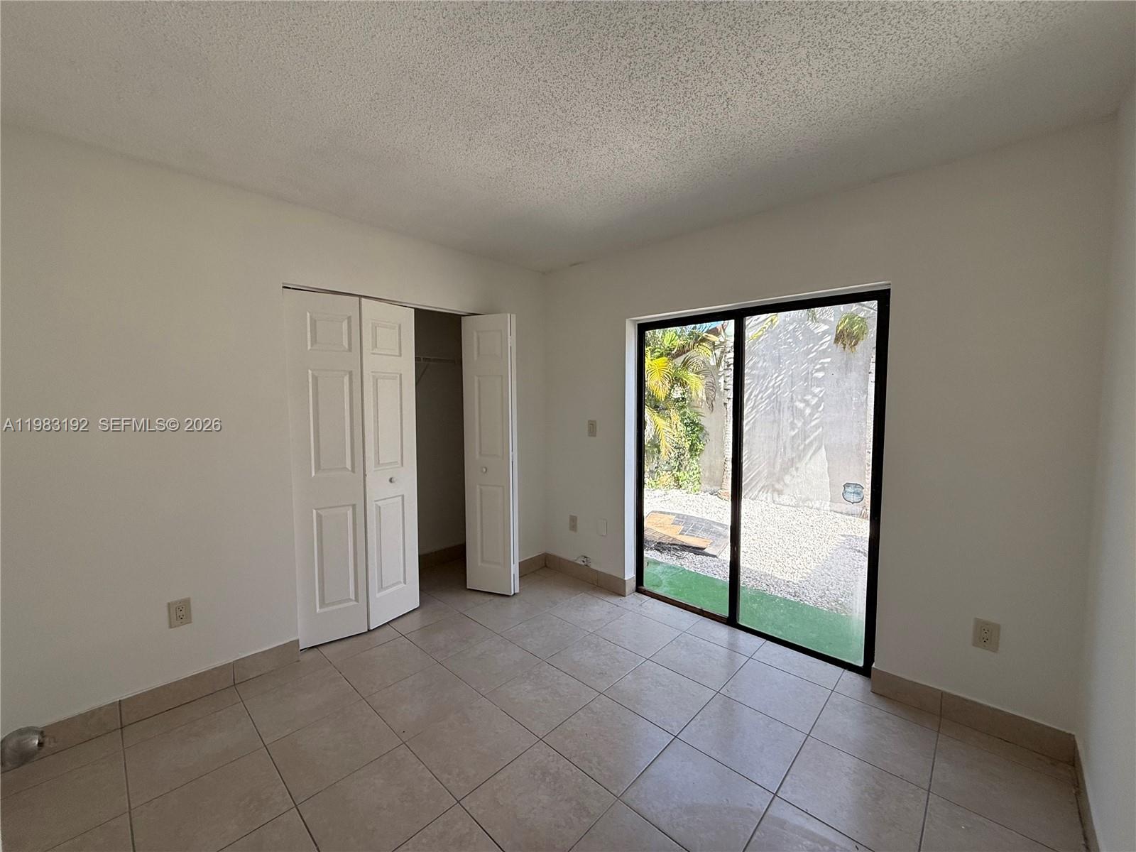 18260 Southwest 142nd Place Miami, FL 33177 - Photo 15 of 30 a view of an empty room and window