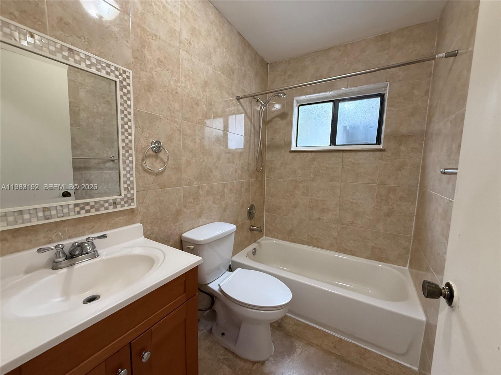 18260 Southwest 142nd Place Miami, FL 33177 - Photo 17 of 30 a bathroom with a sink toilet and shower