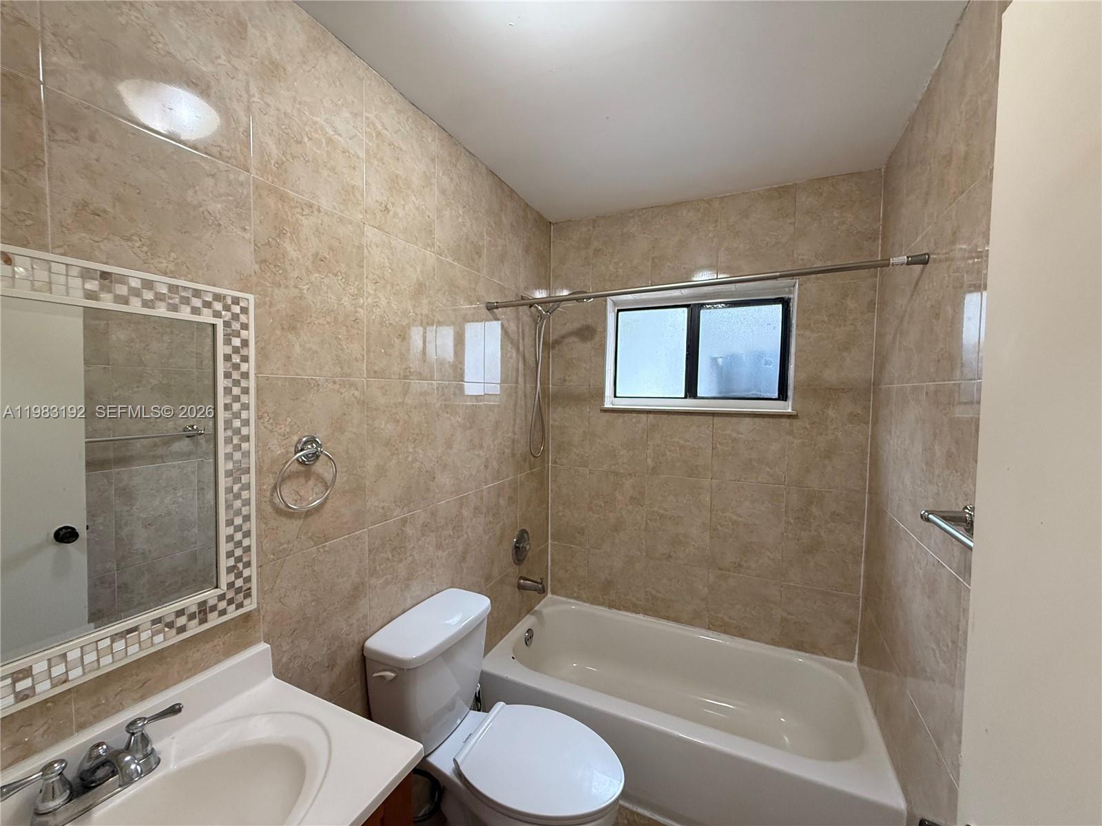 18260 Southwest 142nd Place Miami, FL 33177 - Photo 18 of 30 a bathroom with a toilet and a bathtub