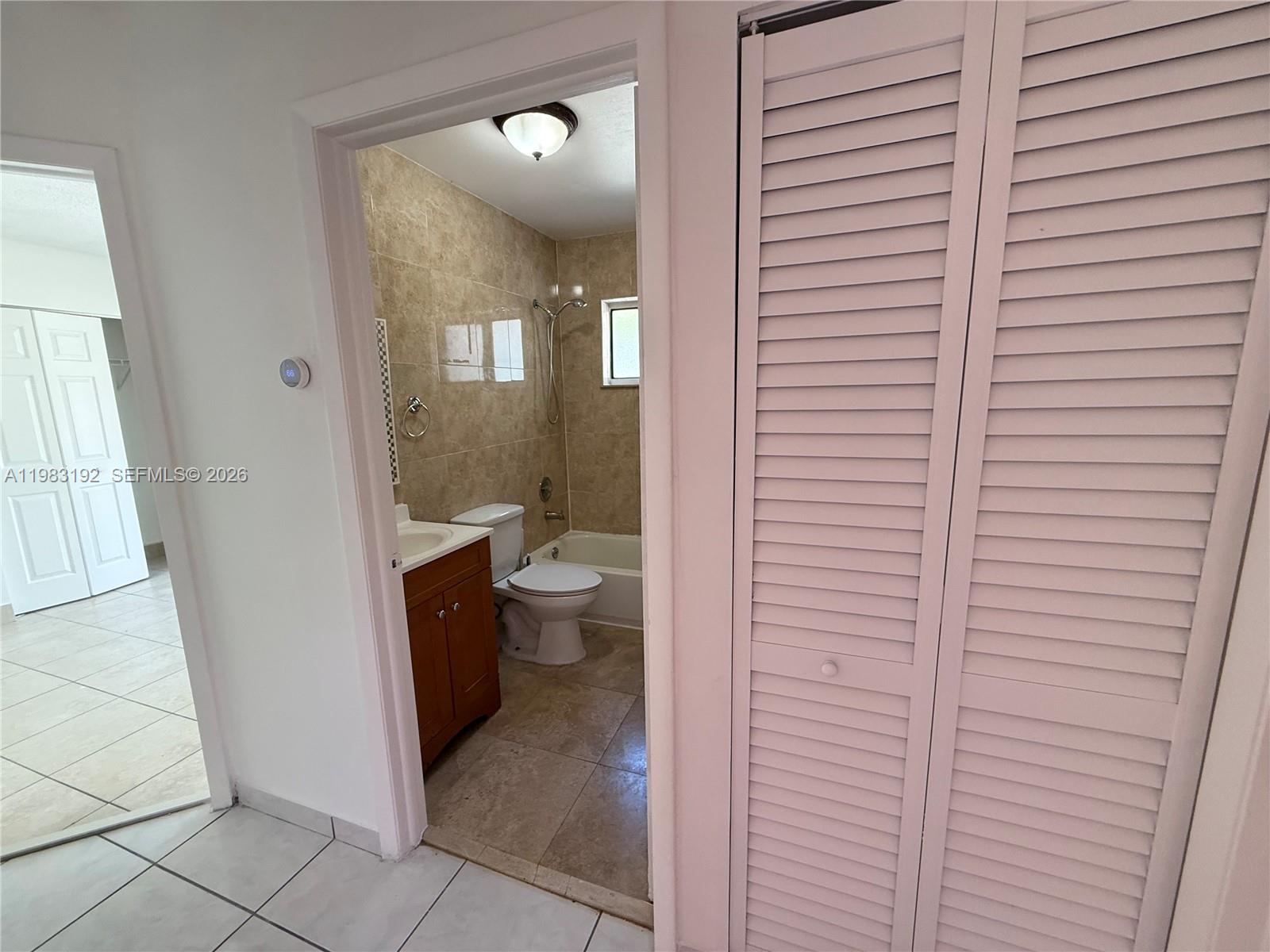 18260 Southwest 142nd Place Miami, FL 33177 - Photo 22 of 30 a bathroom with a toilet and a shower