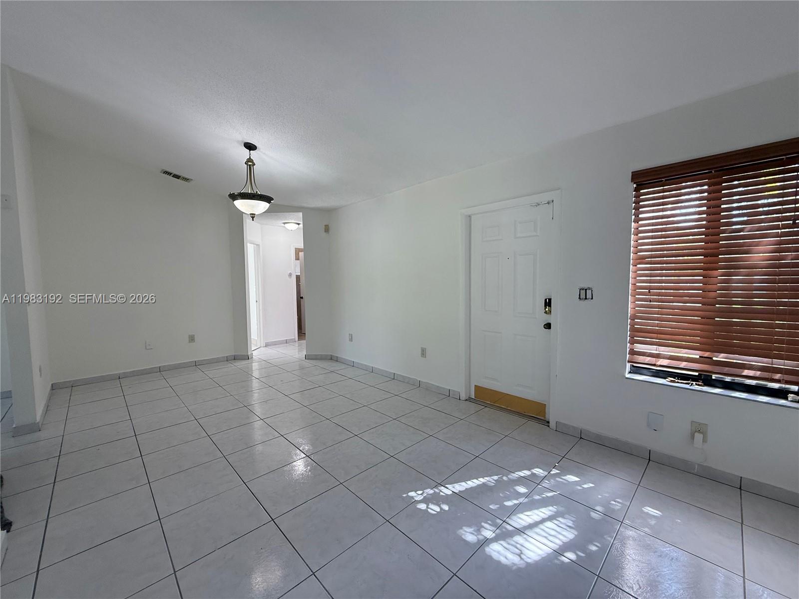 18260 Southwest 142nd Place Miami, FL 33177 - Photo 27 of 30 a view of an empty room with a window