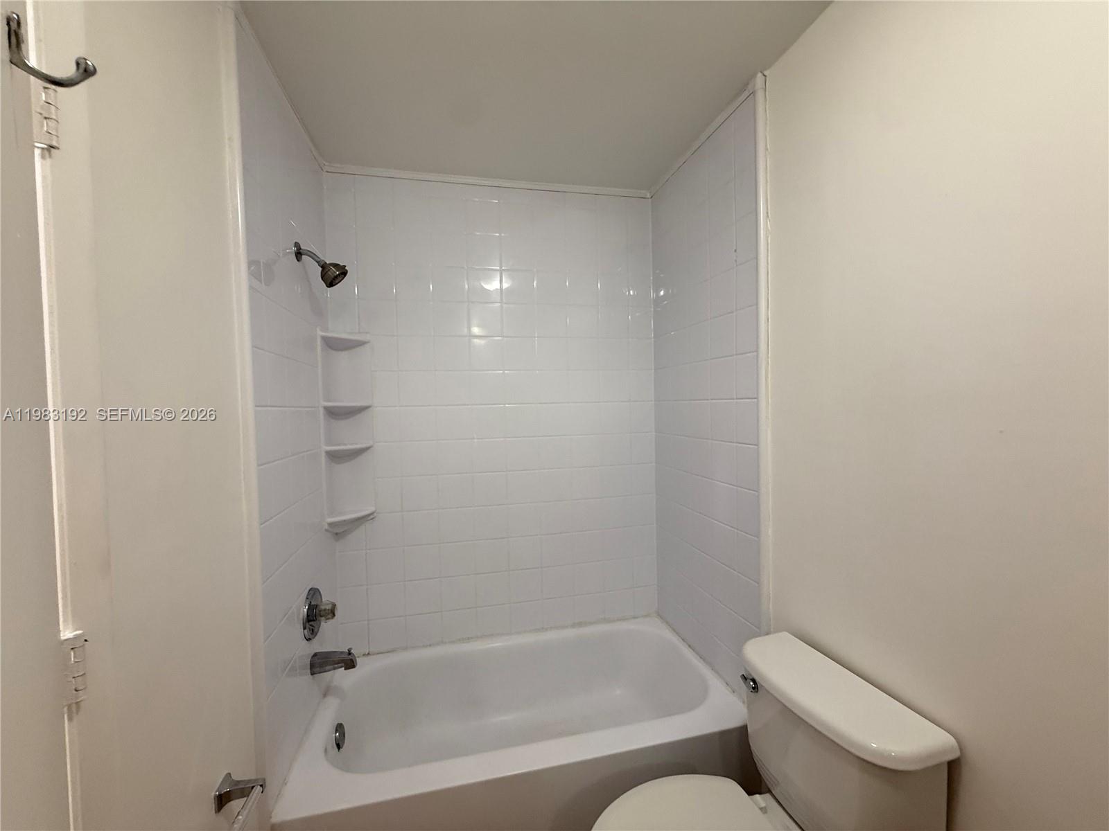 18260 Southwest 142nd Place Miami, FL 33177 - Photo 8 of 30 a bathroom with a toilet and a bathtub