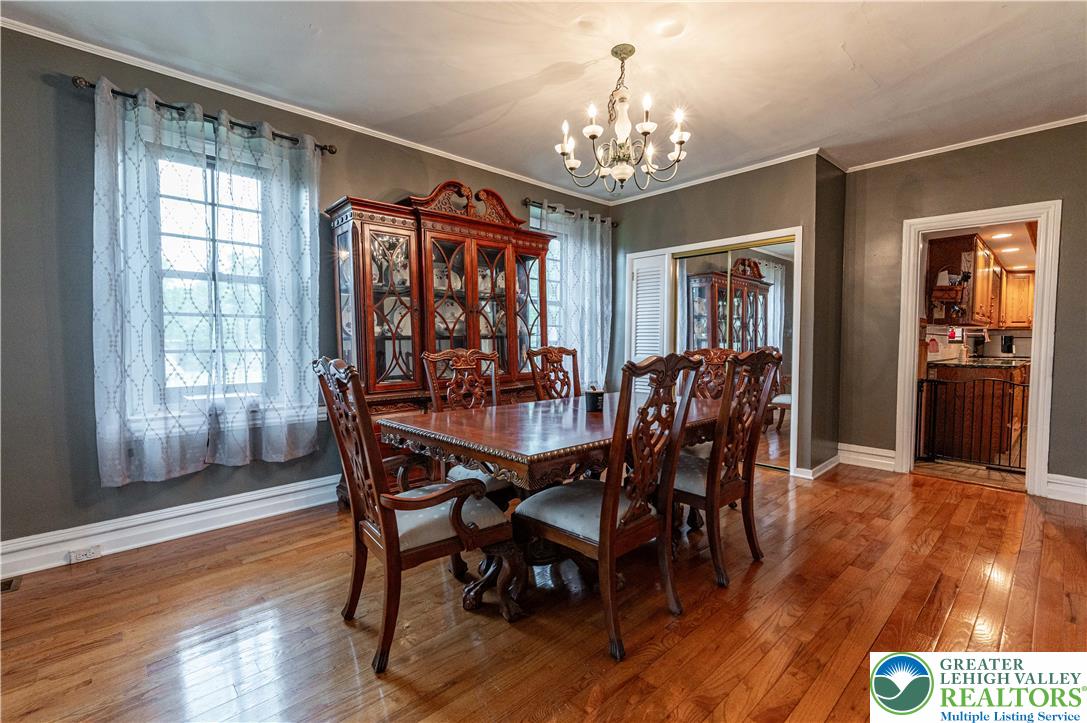 2485 Hieter Road Quakertown, PA 18951 - Photo 22 of 97 Hardwood floors and a sophisticated chandelier define this elegant dining space.
