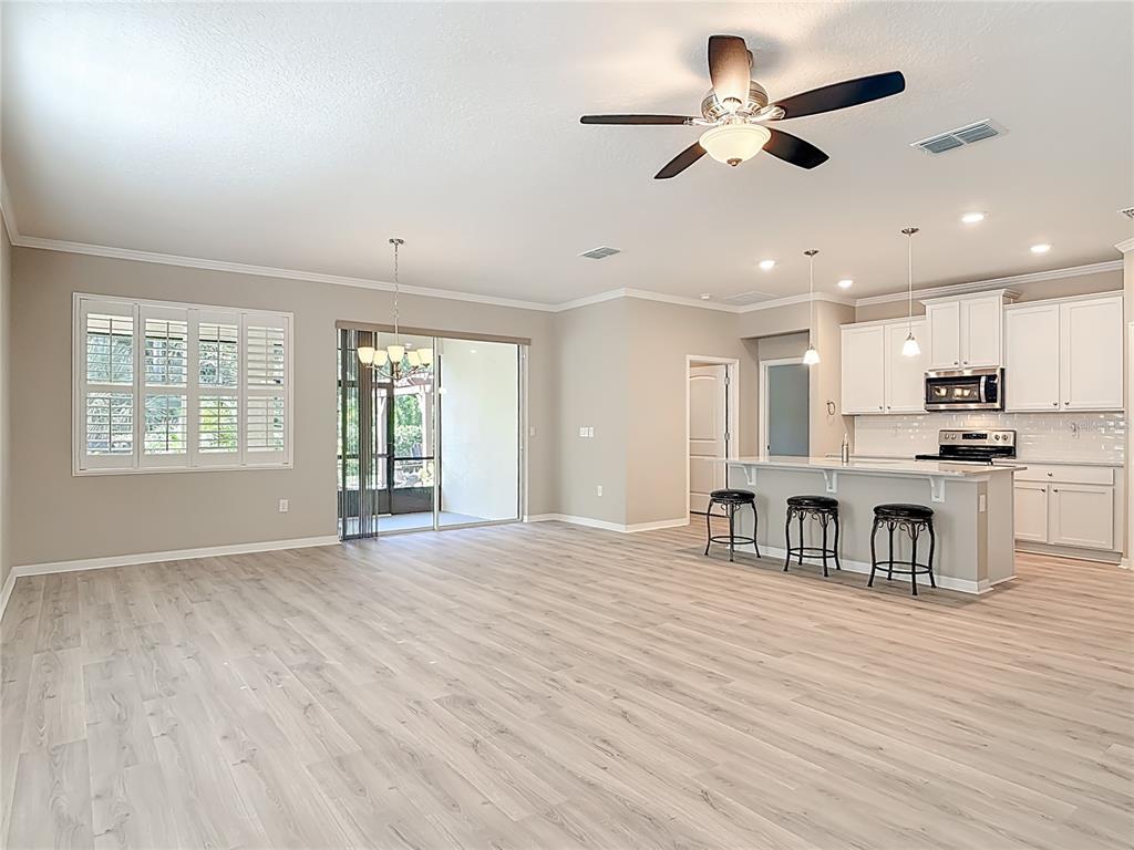 1632 Delphi Way New Smyrna Beach, FL 32168 - Photo 12 of 52 a view of kitchen with stove and furniture