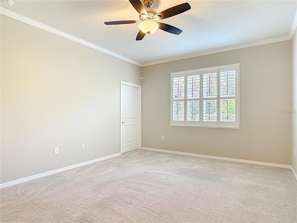 1632 Delphi Way New Smyrna Beach, FL 32168 - Photo 21 of 52 a view of an empty room with a window