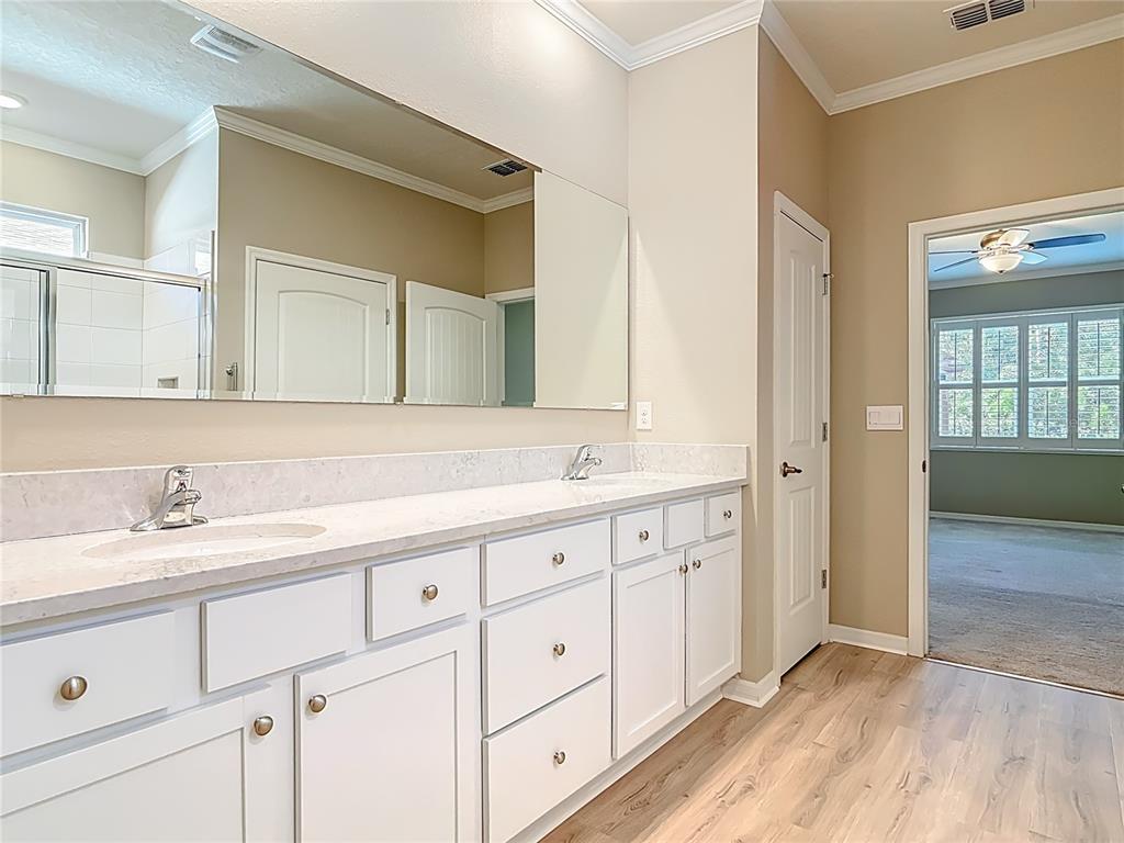 1632 Delphi Way New Smyrna Beach, FL 32168 - Photo 26 of 52 a bathroom with a double vanity sink and a