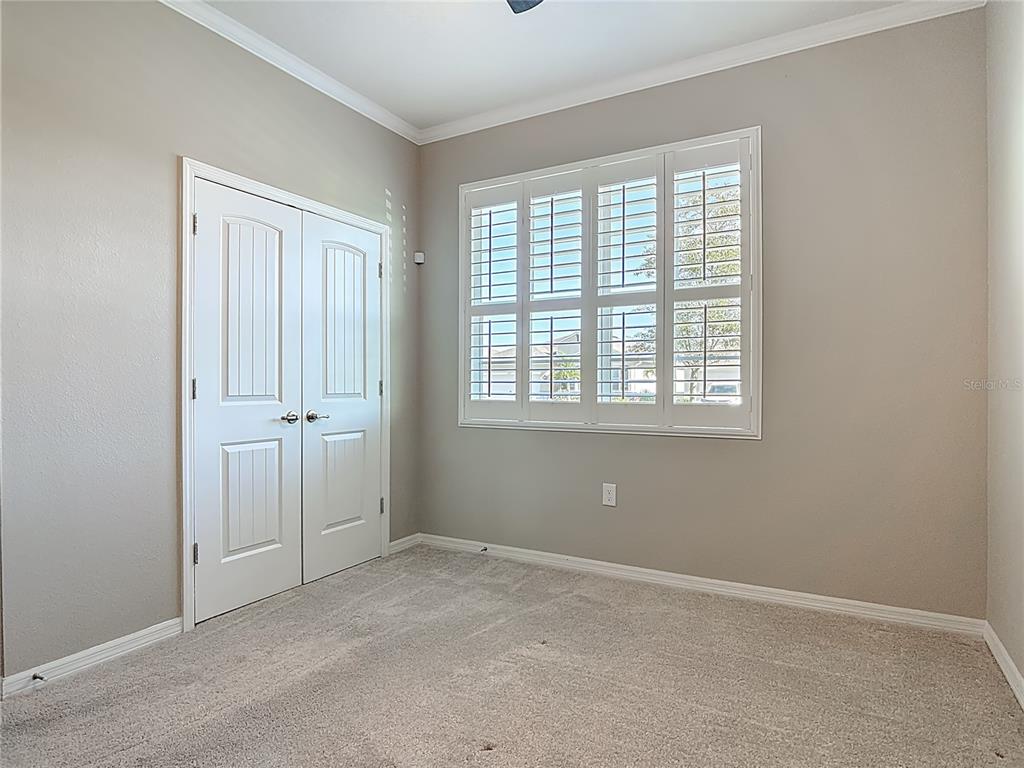 1632 Delphi Way New Smyrna Beach, FL 32168 - Photo 27 of 52 an empty room with windows