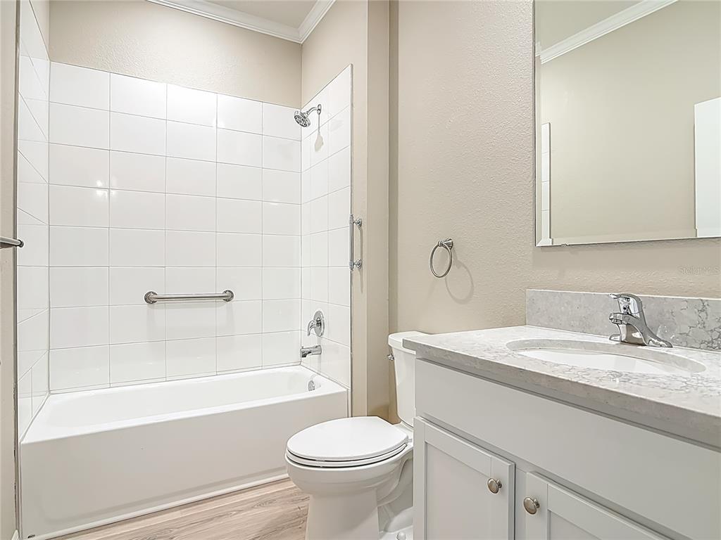 1632 Delphi Way New Smyrna Beach, FL 32168 - Photo 31 of 52 a bathroom with a sink toilet and shower