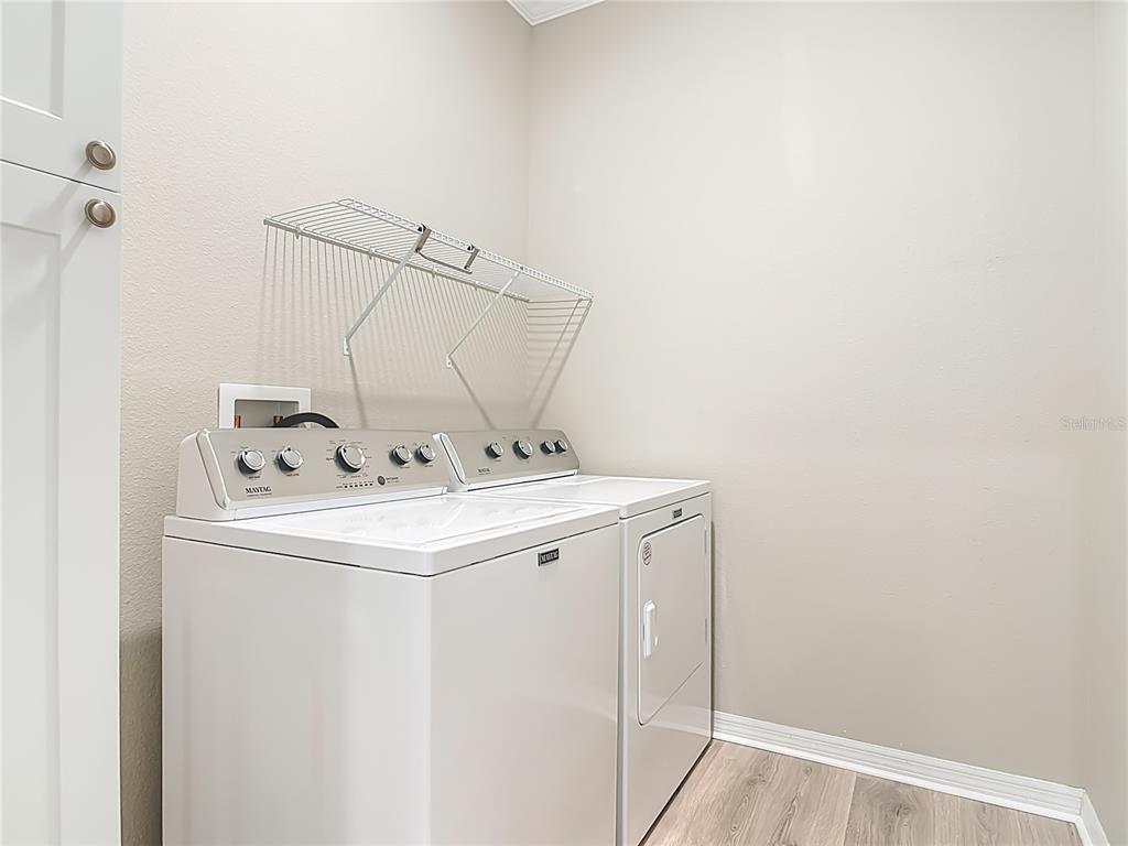 1632 Delphi Way New Smyrna Beach, FL 32168 - Photo 34 of 52 a utility room with dryer and washer