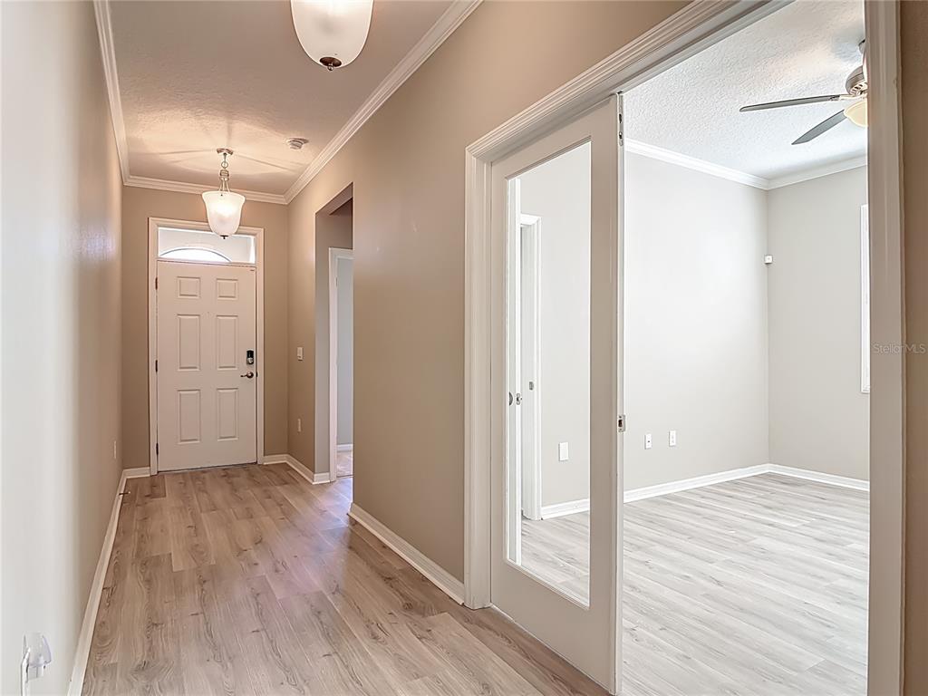 1632 Delphi Way New Smyrna Beach, FL 32168 - Photo 6 of 52 a view of hallway with wooden floor