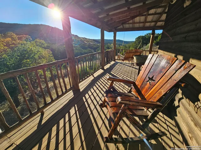 a view of balcony with furniture