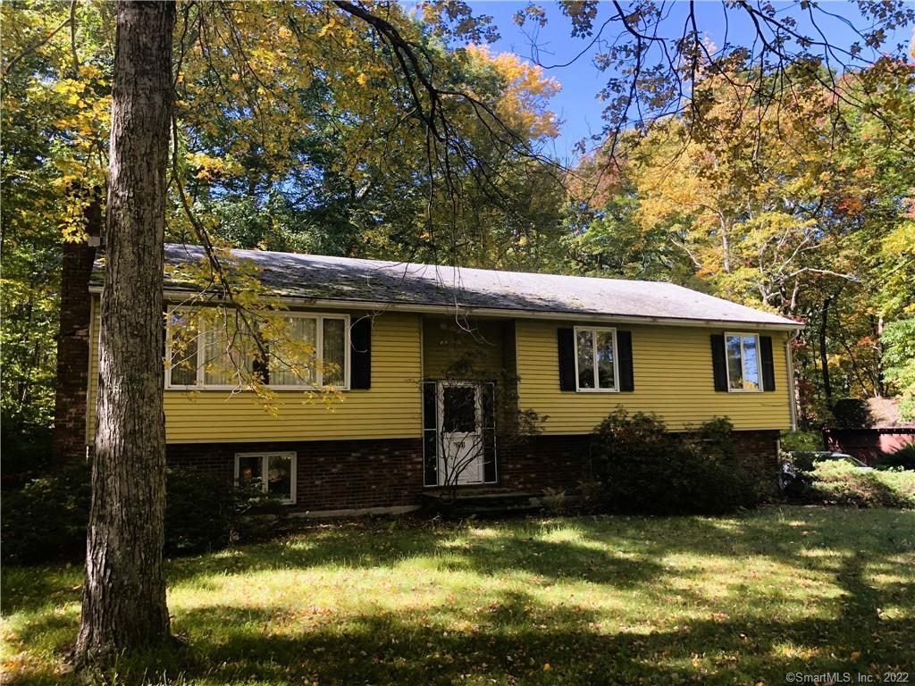 291 Newton Road Litchfield, CT 06759 - Photo 1 of 1 a front view of a house with a yard table and chairs