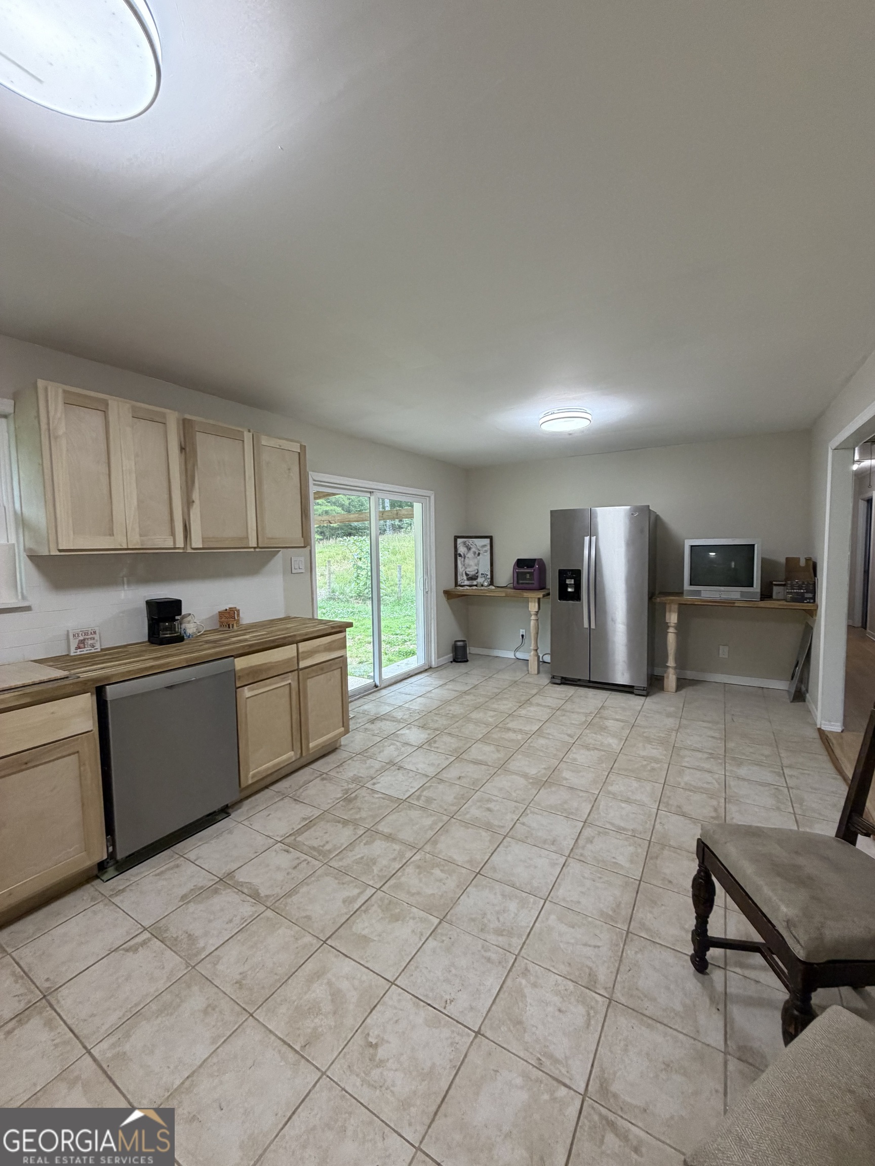 1144 Ridgeway Road LaFayette, GA 30728 - Photo 59 of 66 a kitchen with a sink refrigerator and cabinets