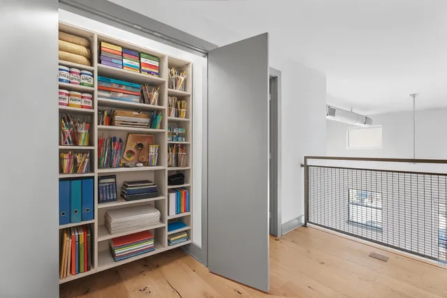 a view of walk in closet with empty racks