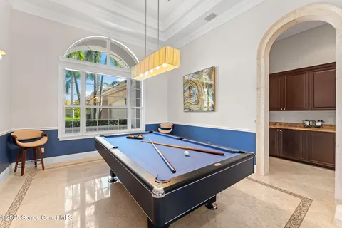 a kitchen that has a lot of cabinets in it and wooden floors
