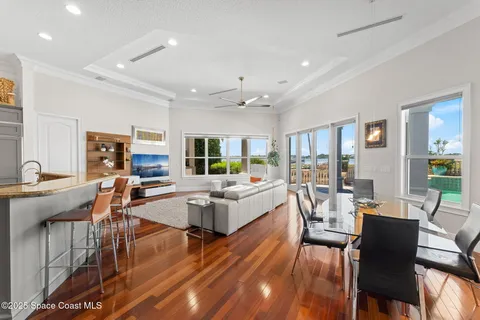 a kitchen with kitchen island granite countertop a sink cabinets and stainless steel appliances