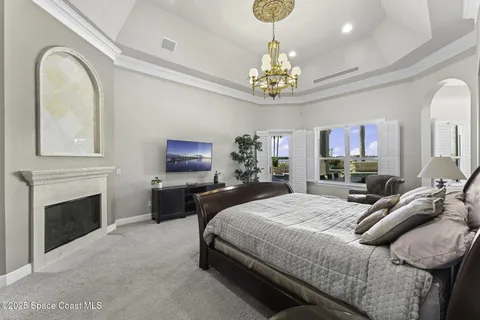 a bedroom with a bed and a couch