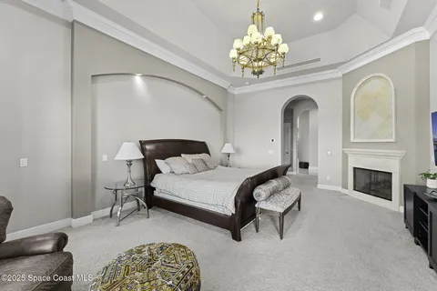 a bedroom with a bed and a table