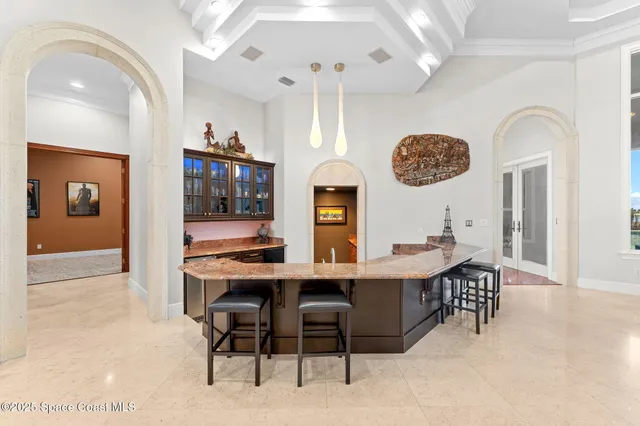 a spacious bathroom with a granite countertop sink and a large mirror