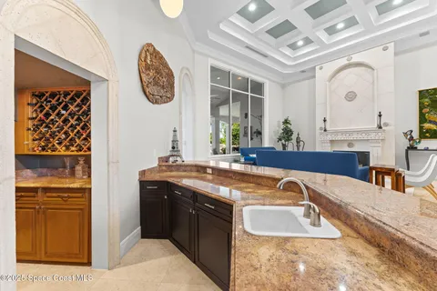 a living room with fireplace furniture and a wooden floor