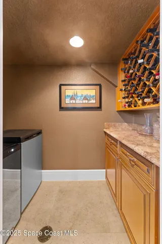 a room with pool table and windows