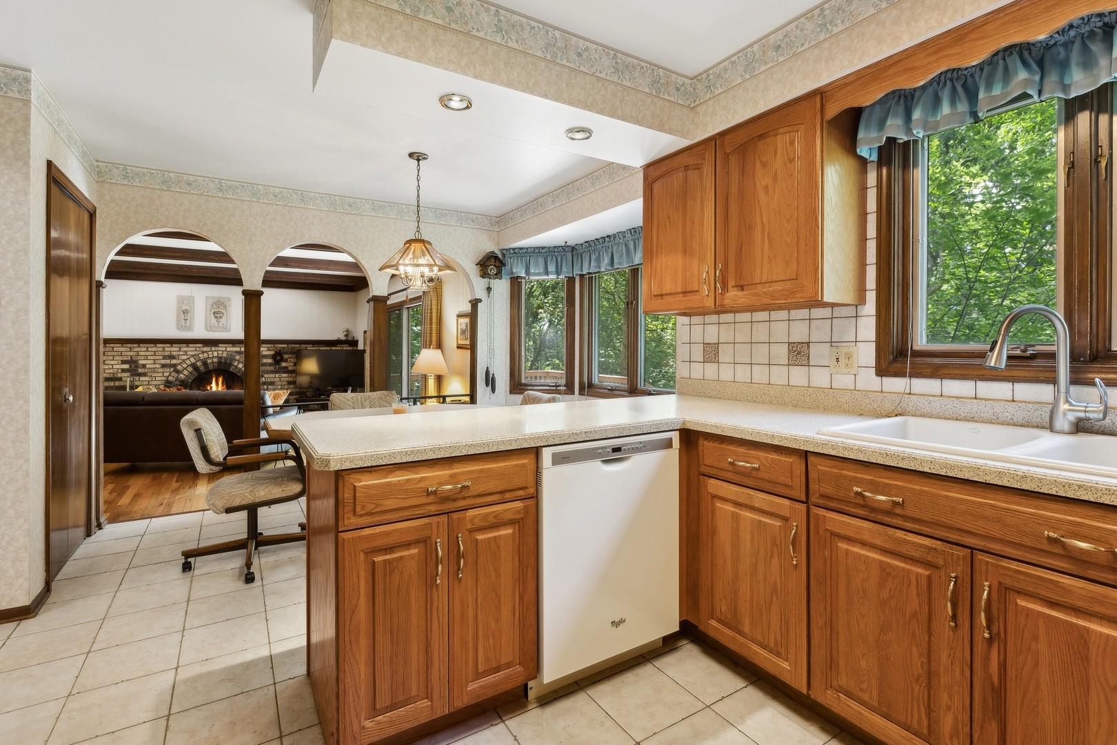 40W173 Oak Ridge Road St. Charles, IL 60175 - Photo 13 of 38 a kitchen with sink cabinets and window