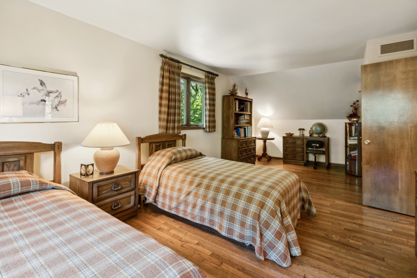 40W173 Oak Ridge Road St. Charles, IL 60175 - Photo 27 of 38 a bedroom with a bed and wooden floor