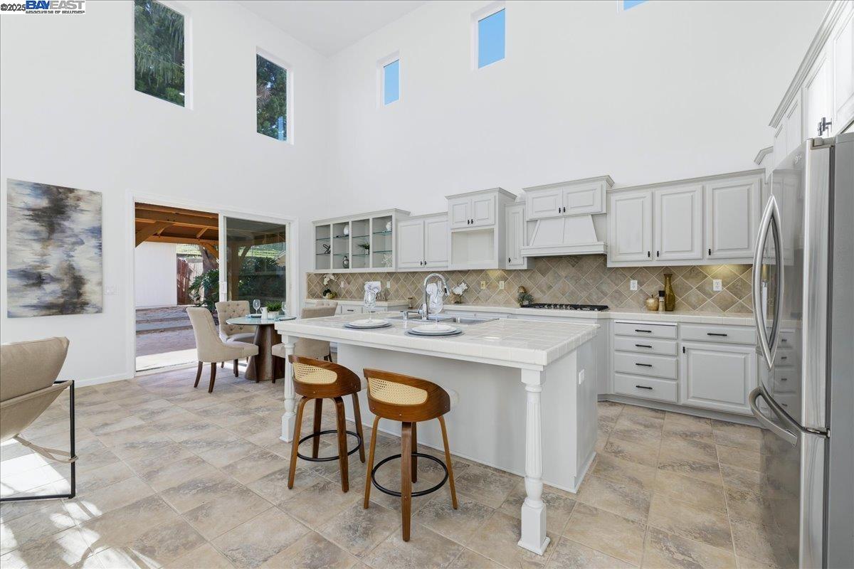 2455 Covelite Way Antioch, CA 94531 - Photo 12 of 60 a kitchen with white cabinets and appliances