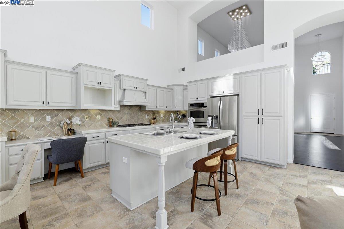 2455 Covelite Way Antioch, CA 94531 - Photo 15 of 60 a kitchen that has a lot of cabinets in it and appliances