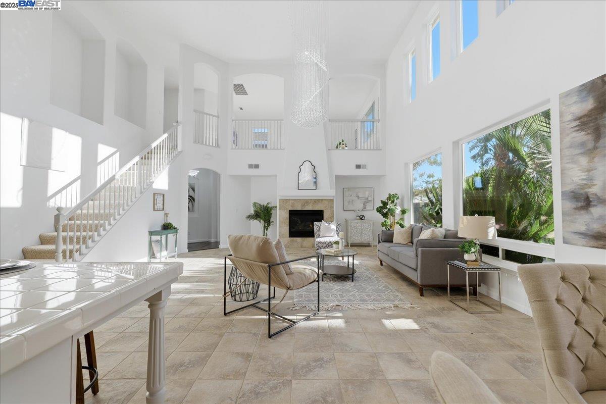 2455 Covelite Way Antioch, CA 94531 - Photo 19 of 60 a living room with furniture a fireplace and a large window