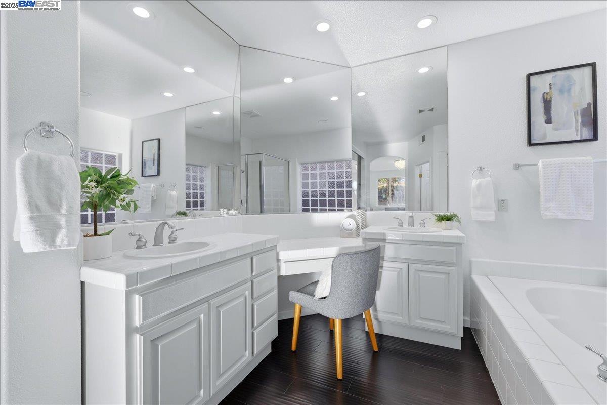 2455 Covelite Way Antioch, CA 94531 - Photo 32 of 60 a bathroom with a sink a toilet and a mirror