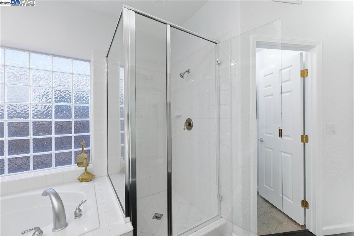 2455 Covelite Way Antioch, CA 94531 - Photo 34 of 60 a bathroom with a sink a tub and shower