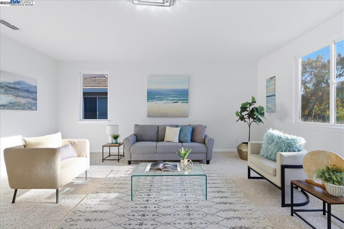 2455 Covelite Way Antioch, CA 94531 - Photo 47 of 60 a living room with furniture and a potted plant on table
