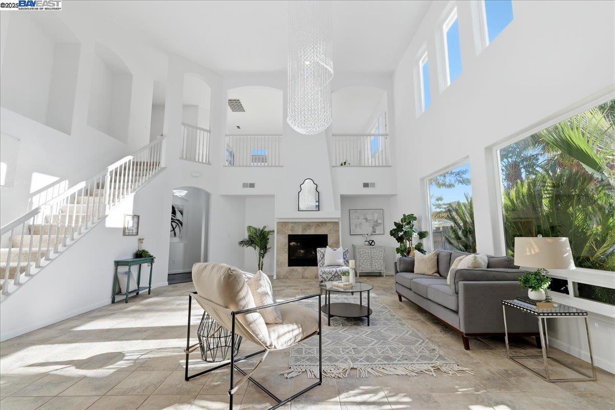 2455 Covelite Way Antioch, CA 94531 - Photo 9 of 60 a living room with furniture a fireplace and a potted plant