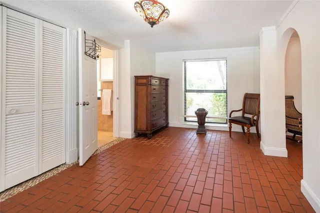 a view of a livingroom with furniture and a window