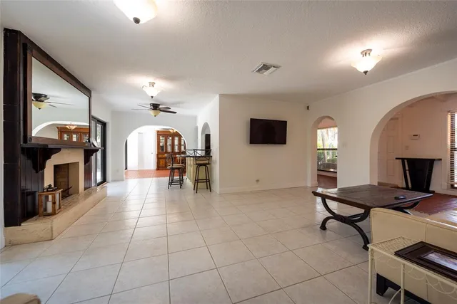 a view of a livingroom with furniture and a flat screen tv