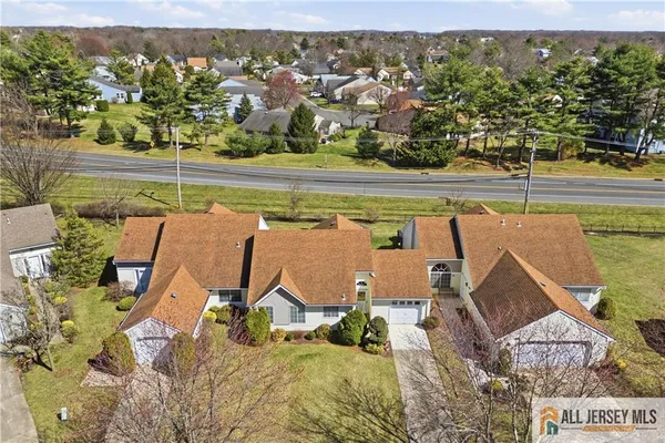 an aerial view of a house with a lake view