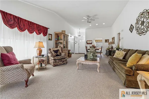 a bedroom with furniture and a chandelier