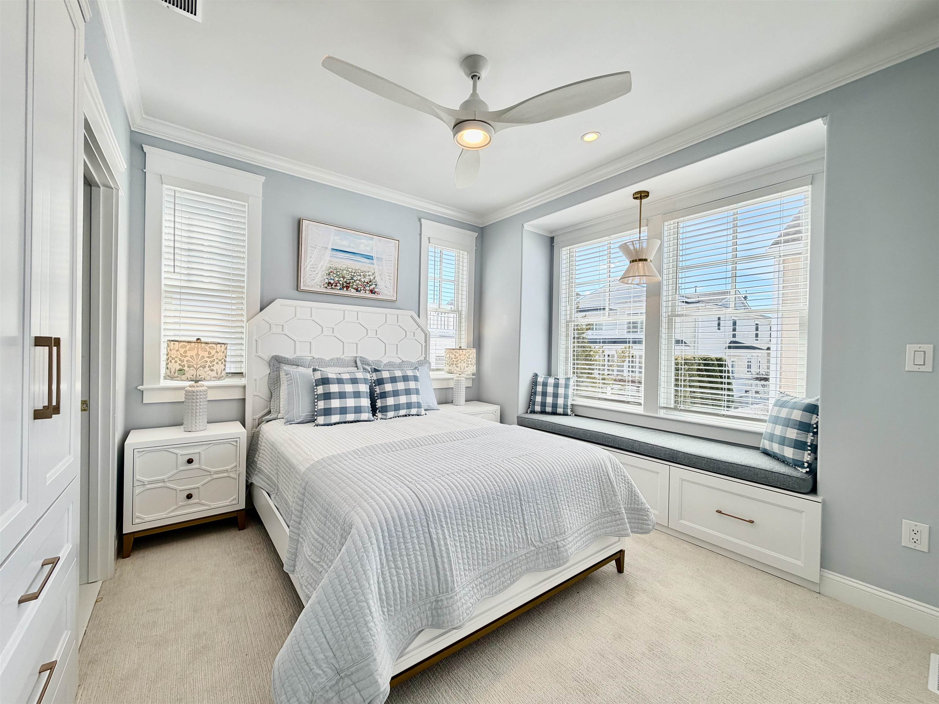 9102 3rd Stone Harbor, NJ 08247 - Photo 17 of 24 a bedroom with a bed and a large window