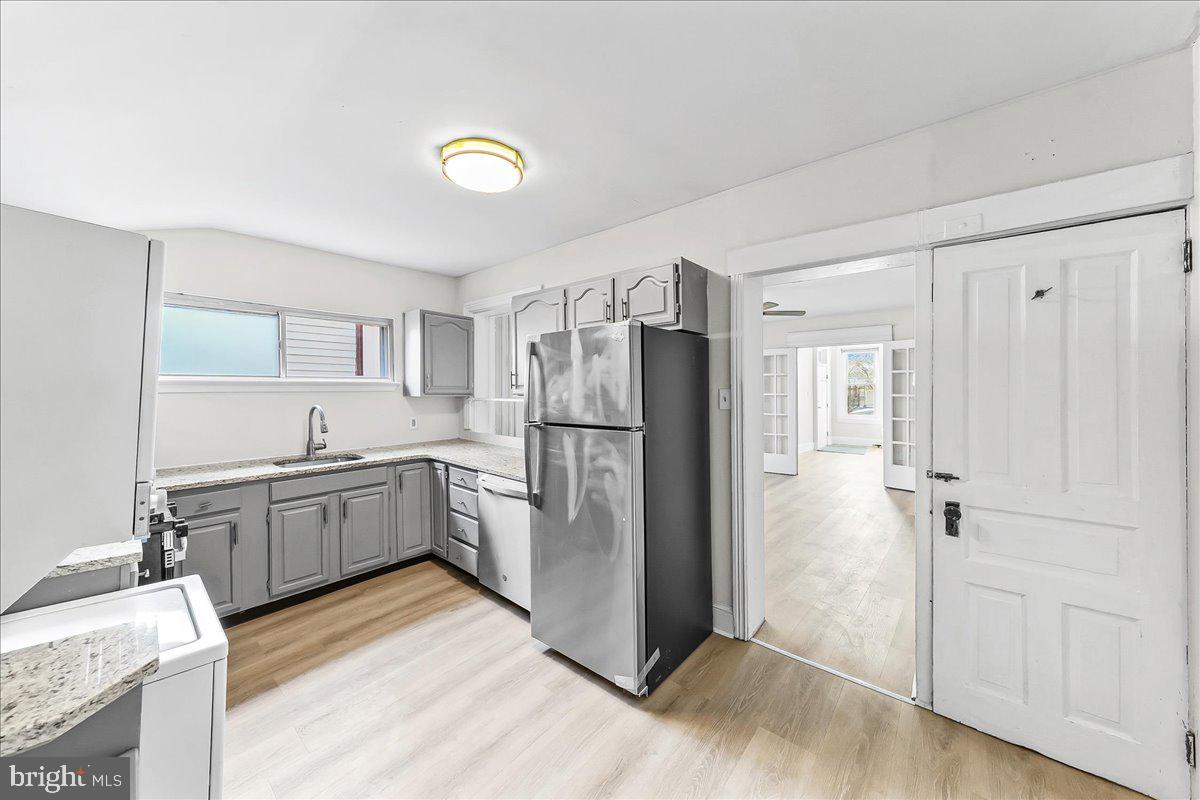 3654 Calumet Street Philadelphia, PA 19129 - Photo 11 of 33 a kitchen with a refrigerator a sink and dishwasher