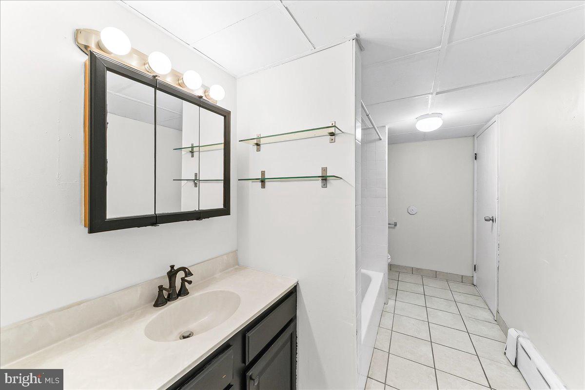 3654 Calumet Street Philadelphia, PA 19129 - Photo 13 of 33 a bathroom with a sink and mirror