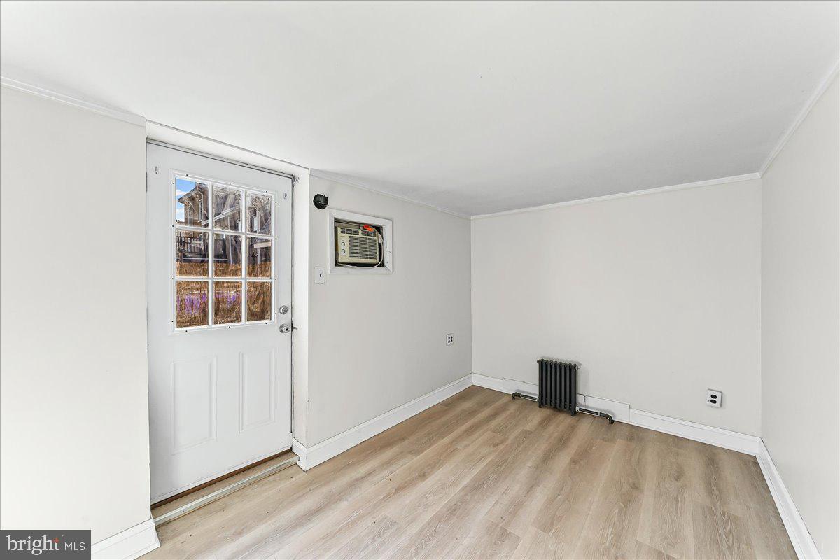 3654 Calumet Street Philadelphia, PA 19129 - Photo 14 of 33 an empty room with wooden floor and windows