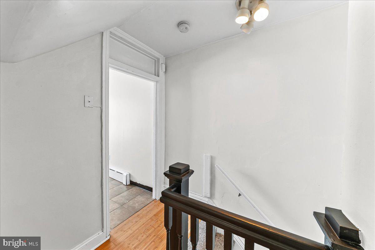 3654 Calumet Street Philadelphia, PA 19129 - Photo 20 of 33 a view of a hallway with paintings on the wall