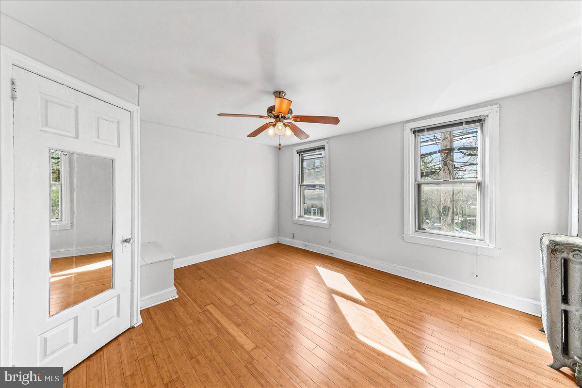 3654 Calumet Street Philadelphia, PA 19129 - Photo 21 of 33 a view of empty room with wooden floor and fan