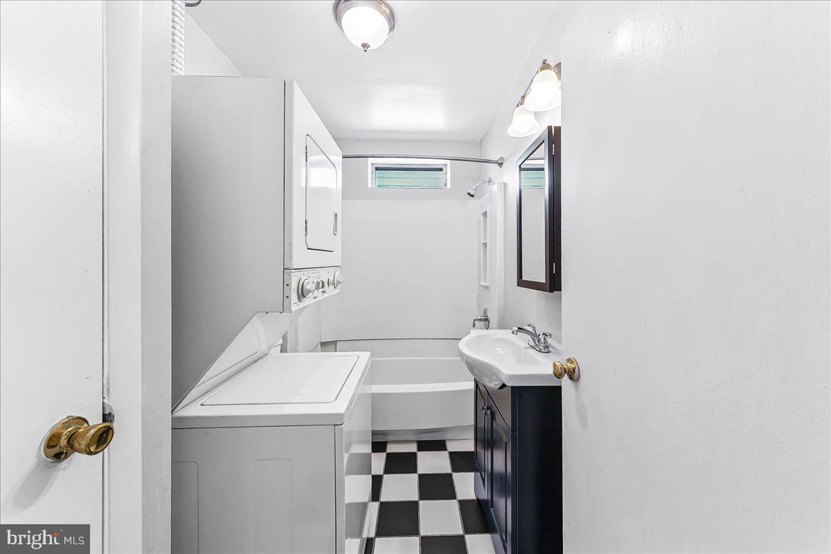 3654 Calumet Street Philadelphia, PA 19129 - Photo 23 of 33 a bathroom with a sink and a mirror