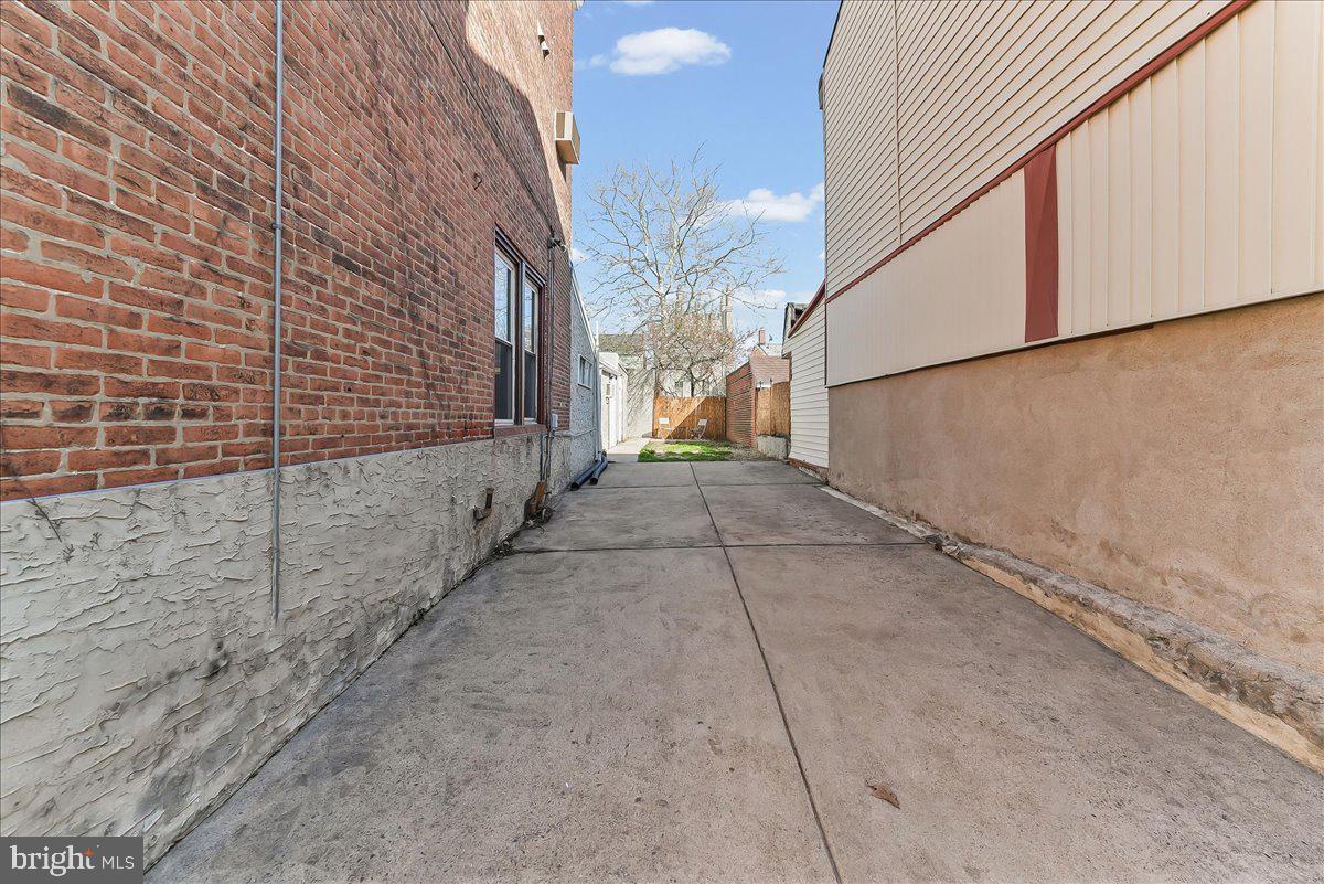 3654 Calumet Street Philadelphia, PA 19129 - Photo 3 of 33 a view of a pathway both side of building