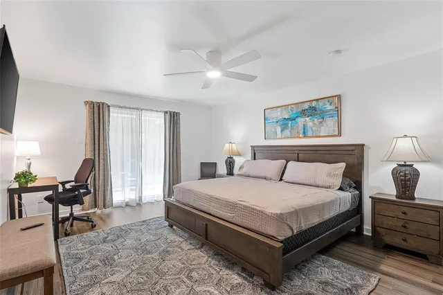 a bedroom with a bed and window